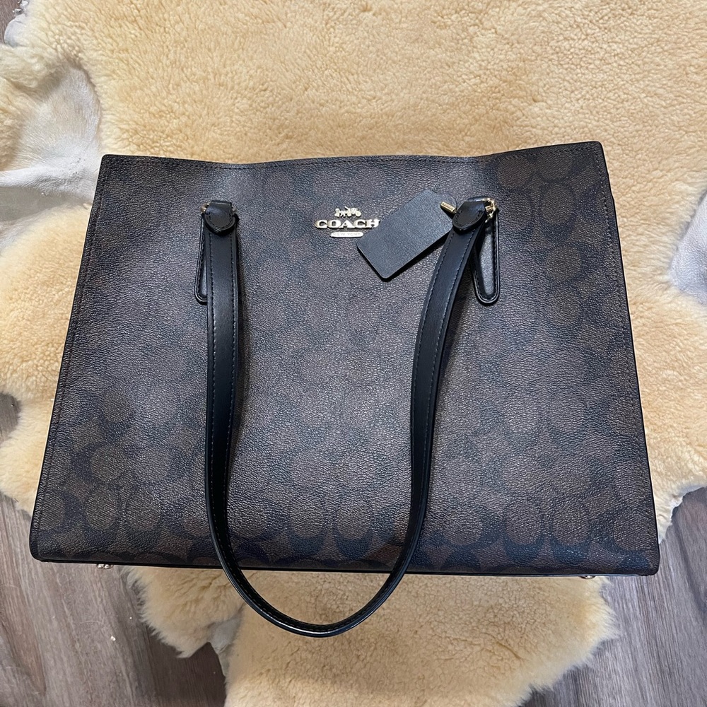 Tatum Carryall in signature Canvas, Black/Brown with Red interior.